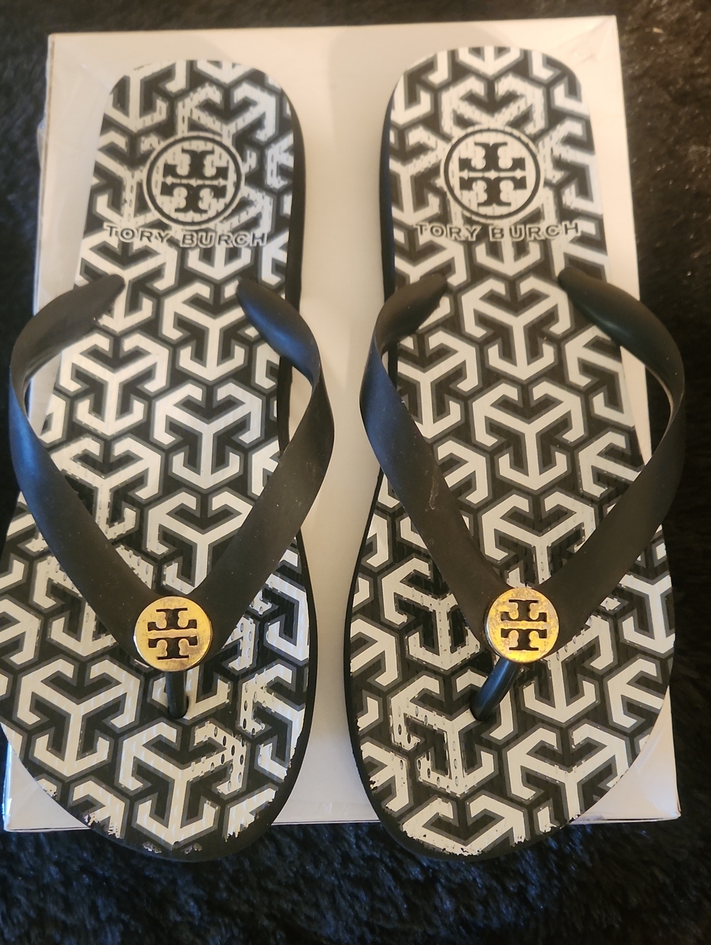 Tory Burch Black and White Geometric Logo Flip Flops with Gold Medallions